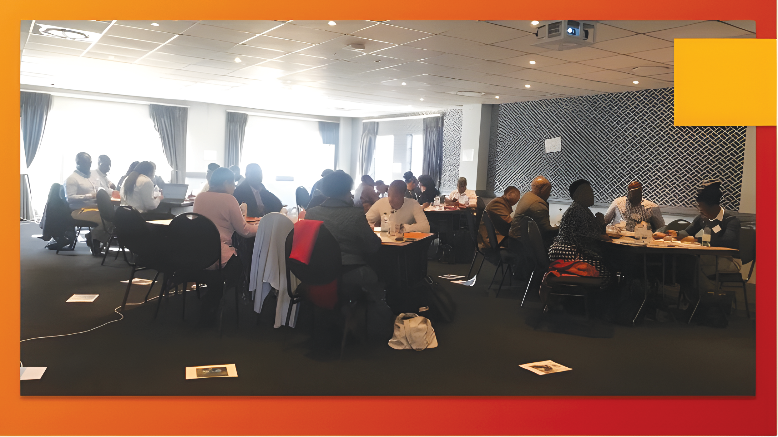 Participants actively engaging in a World Café exercise, a collaborative discussion format.