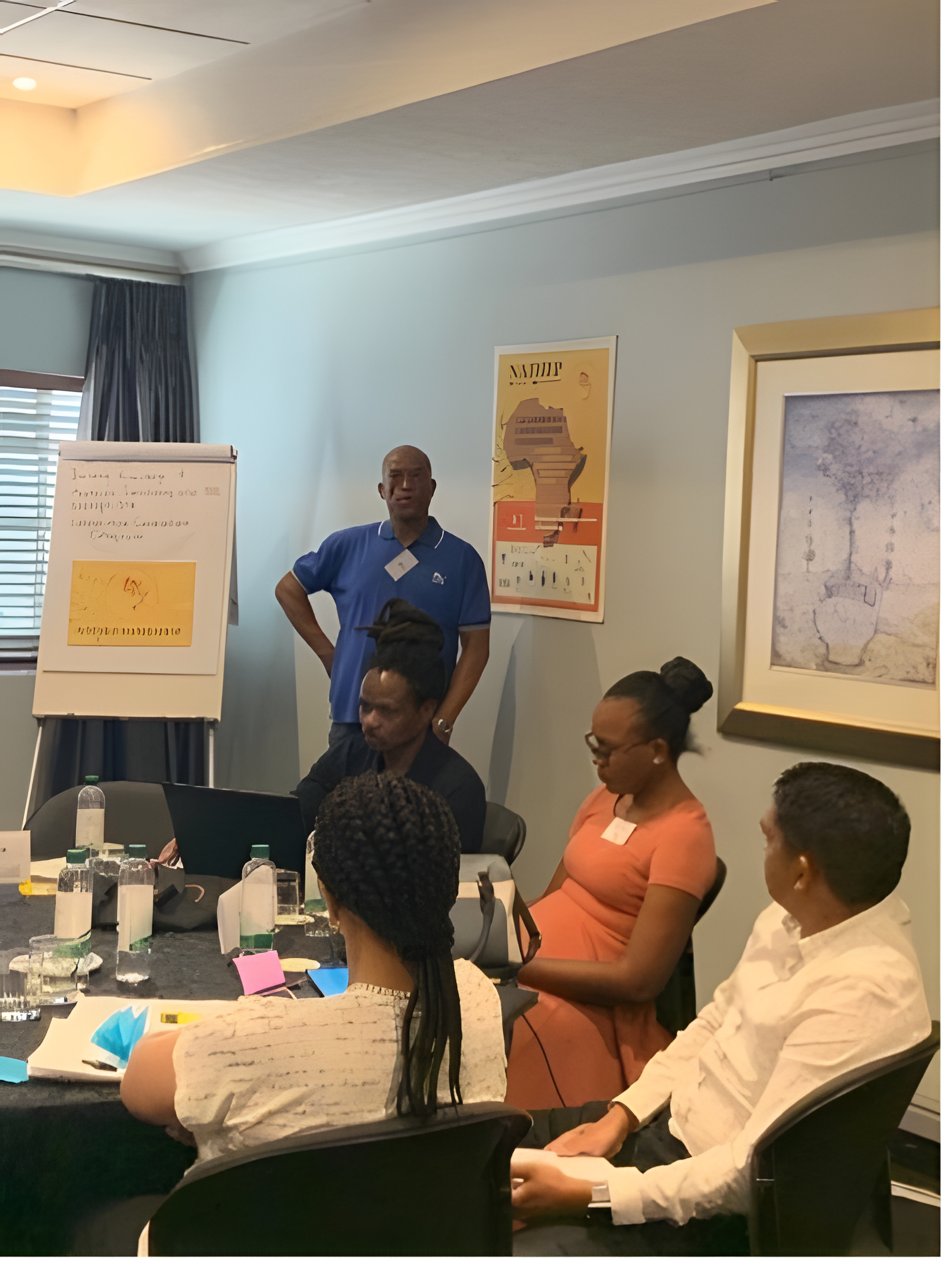 A photograph of Sithembiso Ngubane delivering a presentation at the NATHEP Collaborative Colloquium.